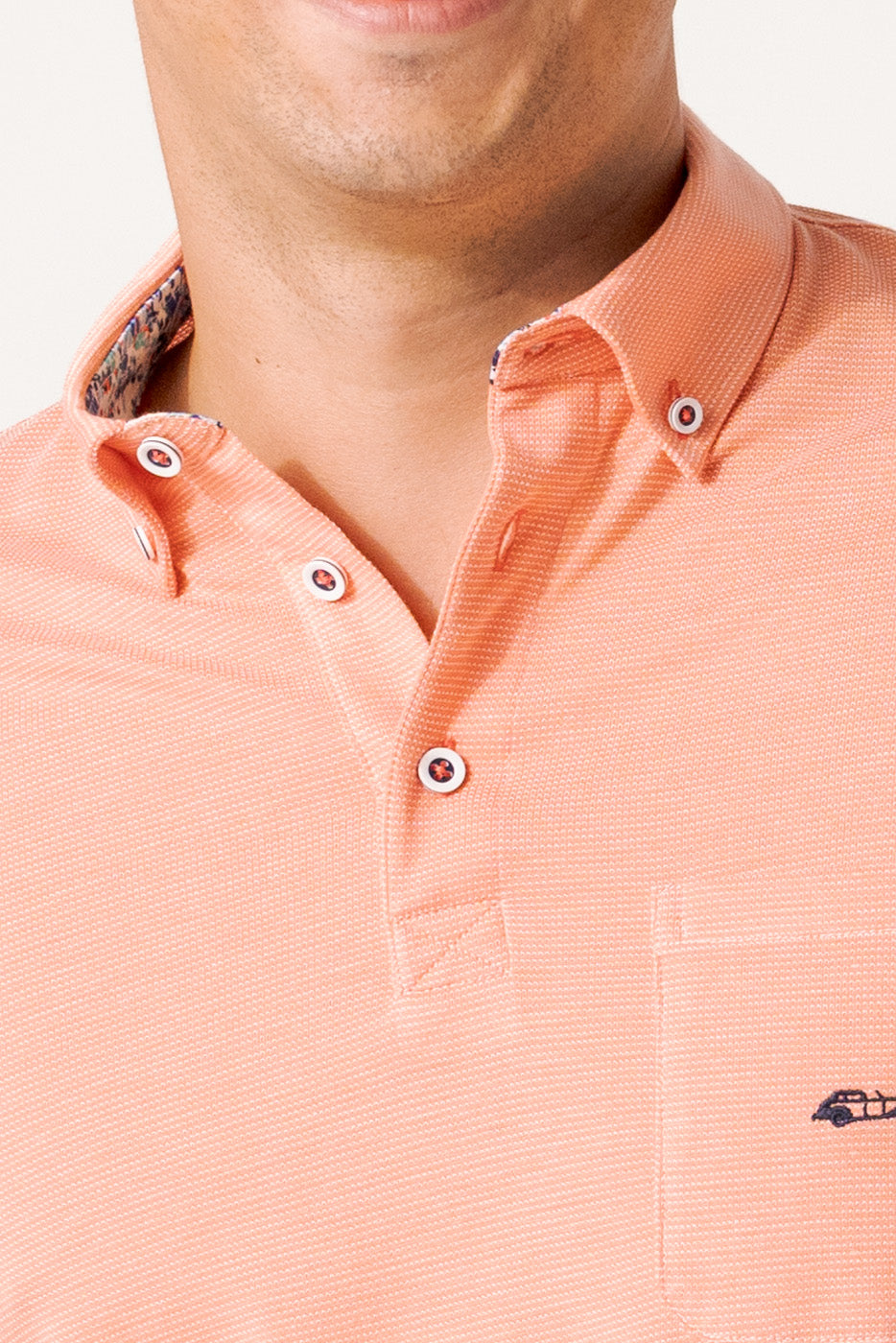Polo jacquard en rayas color coral