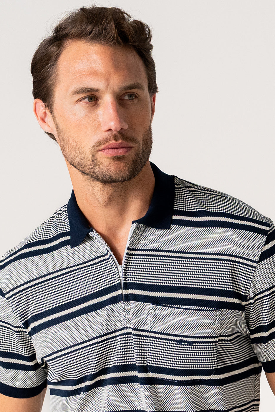 Polo tejido jacquard con cremallera cuello rayas negro